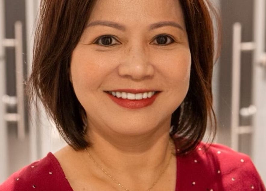 Smiling individual at JEN Salon from Salon Lofts in Fairfax, Virginia, US, highlighting friendly service.