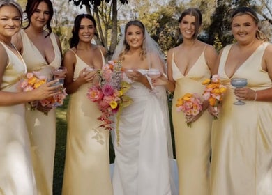 Bridal party at Beachbums Tanning & Hair Bribie in Bongaree, Queensland, AU with stunning floral bouquets.