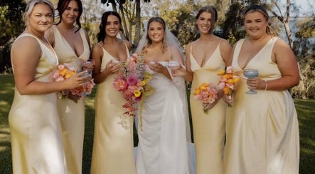 Bridal party at Beachbums Tanning & Hair Bribie, Bongaree, Queensland, AU celebrating outdoors.