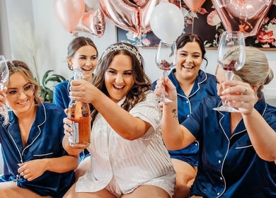 Group celebrating with drinks at Beachbums Tanning & Hair Bribie, Bongaree, Queensland, AU.