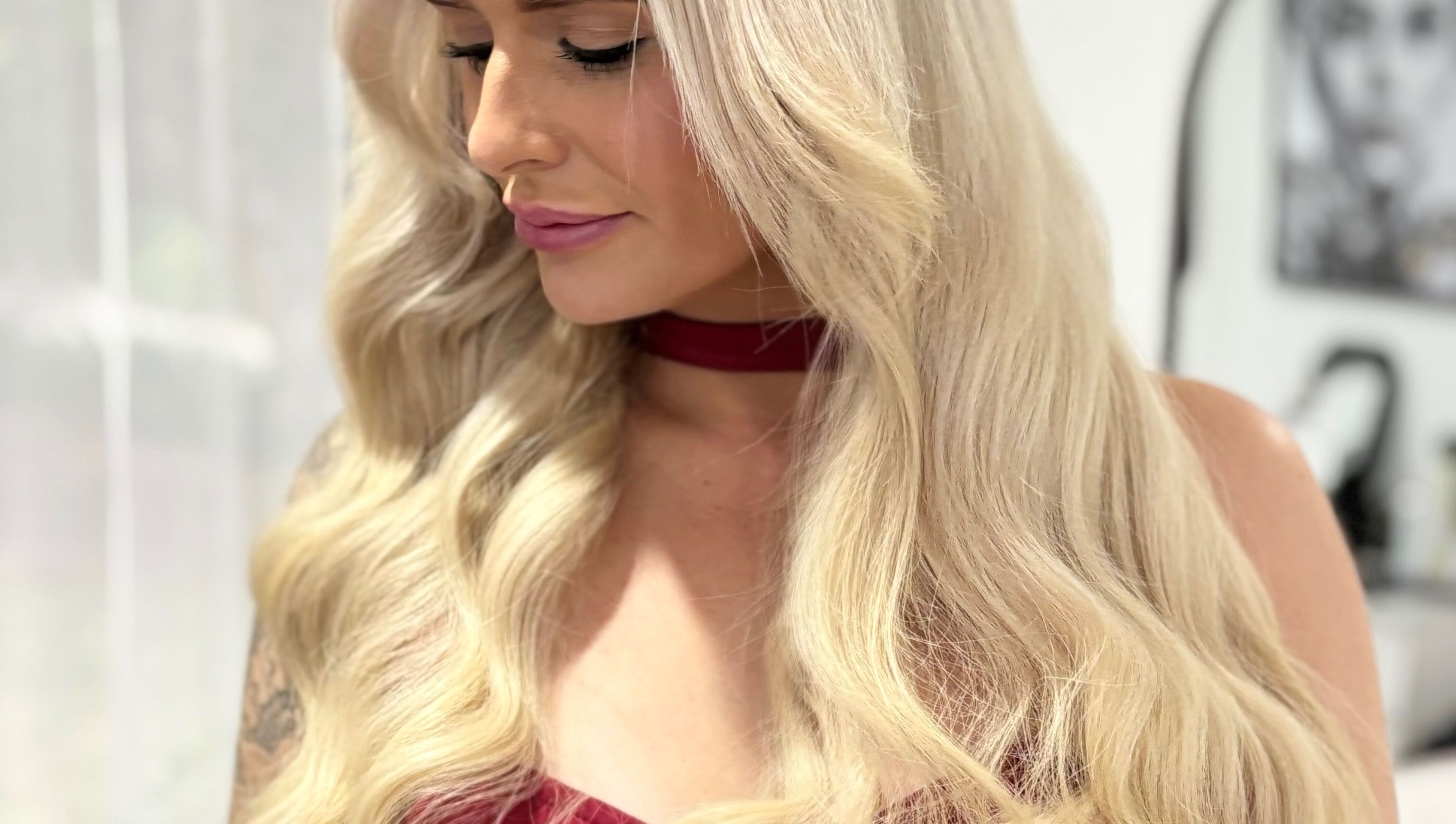 Elegant blonde waves styled at Deluxe Lash & Locks in West Wodonga, Victoria, AU, showcasing expert beauty care.