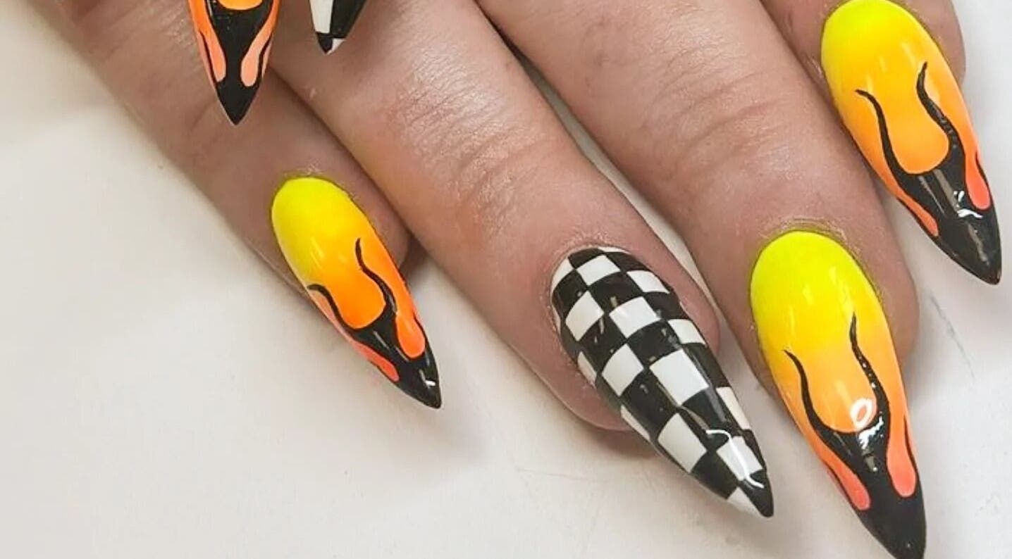 Vibrant flame and checkered nail design at Cute But Deadly nail co. Bathgate, in Bathgate, Scotland, GB.
