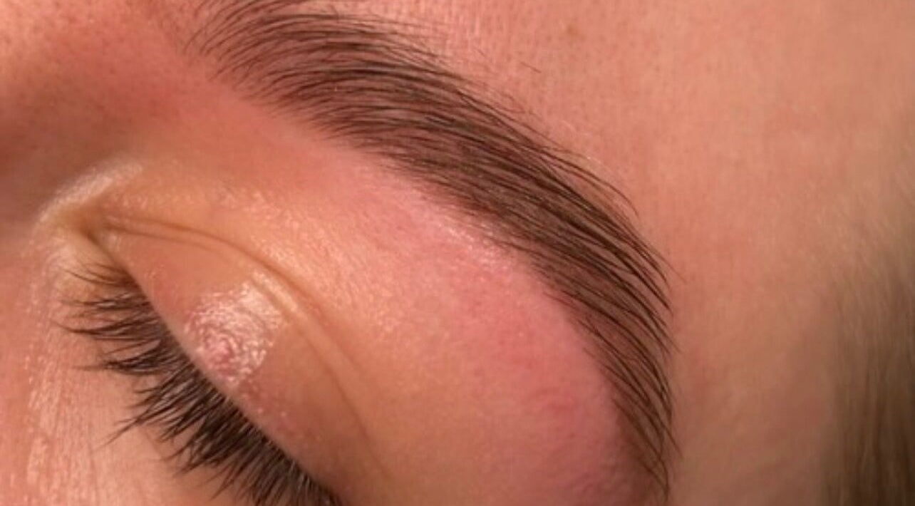 Expert brow shaping at Lashed by Linz, Basingstoke, England, GB enhances natural beauty.