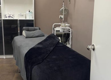 Cozy treatment room at Deera Spa and Beauty, Goodwood, South Australia, AU, featuring massage bed and equipment.