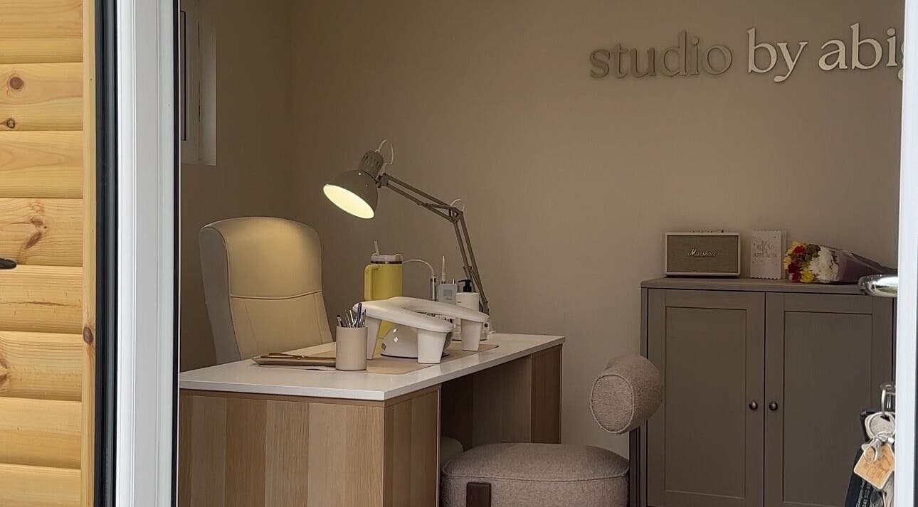 Cozy nail desk setup at Studio by Abigail, Coatbridge, Scotland, GB, showcasing a modern wellness atmosphere.