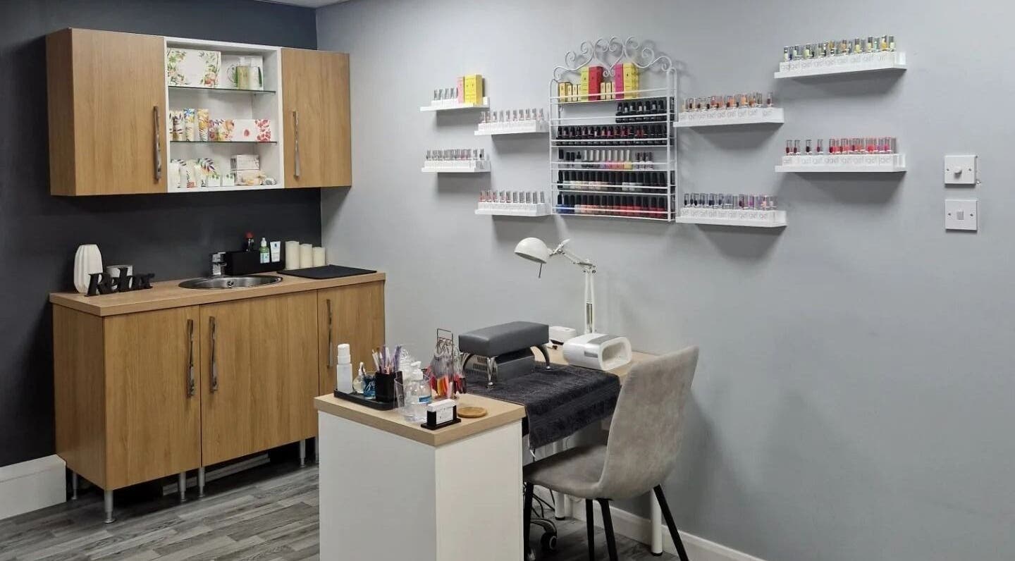 Elegant nail care station at Beauty By Emma, Preston, England, GB, featuring diverse nail polish display.