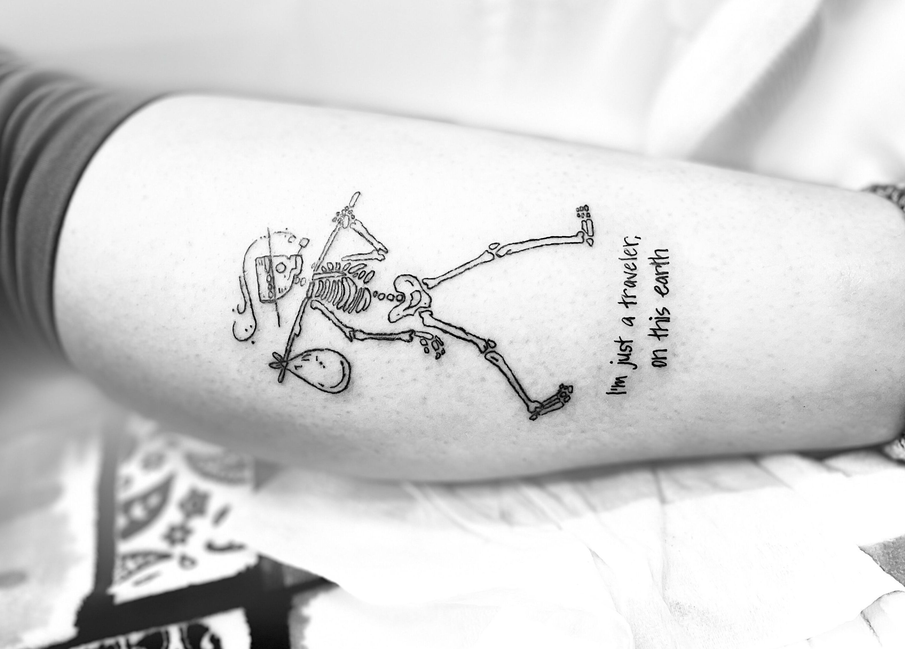 Unique skeleton tattoo art on arm at Longhorn Beauty Academy, Post Falls, Idaho, US.