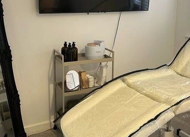 Luxurious treatment room at Jess Palmer Beauty, Bridgwater, England, featuring a plush spa bed and chic decor.