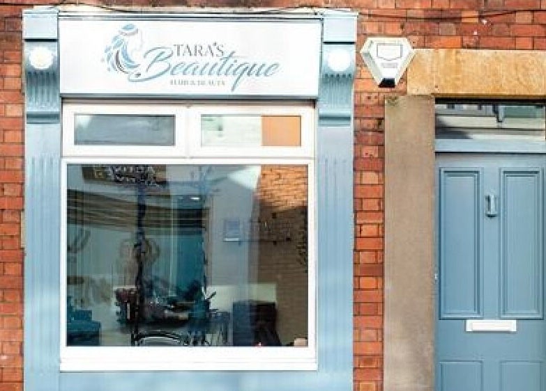 Tara’s Beautique inviting store front in Bristol, England, GB with elegant window and door display.