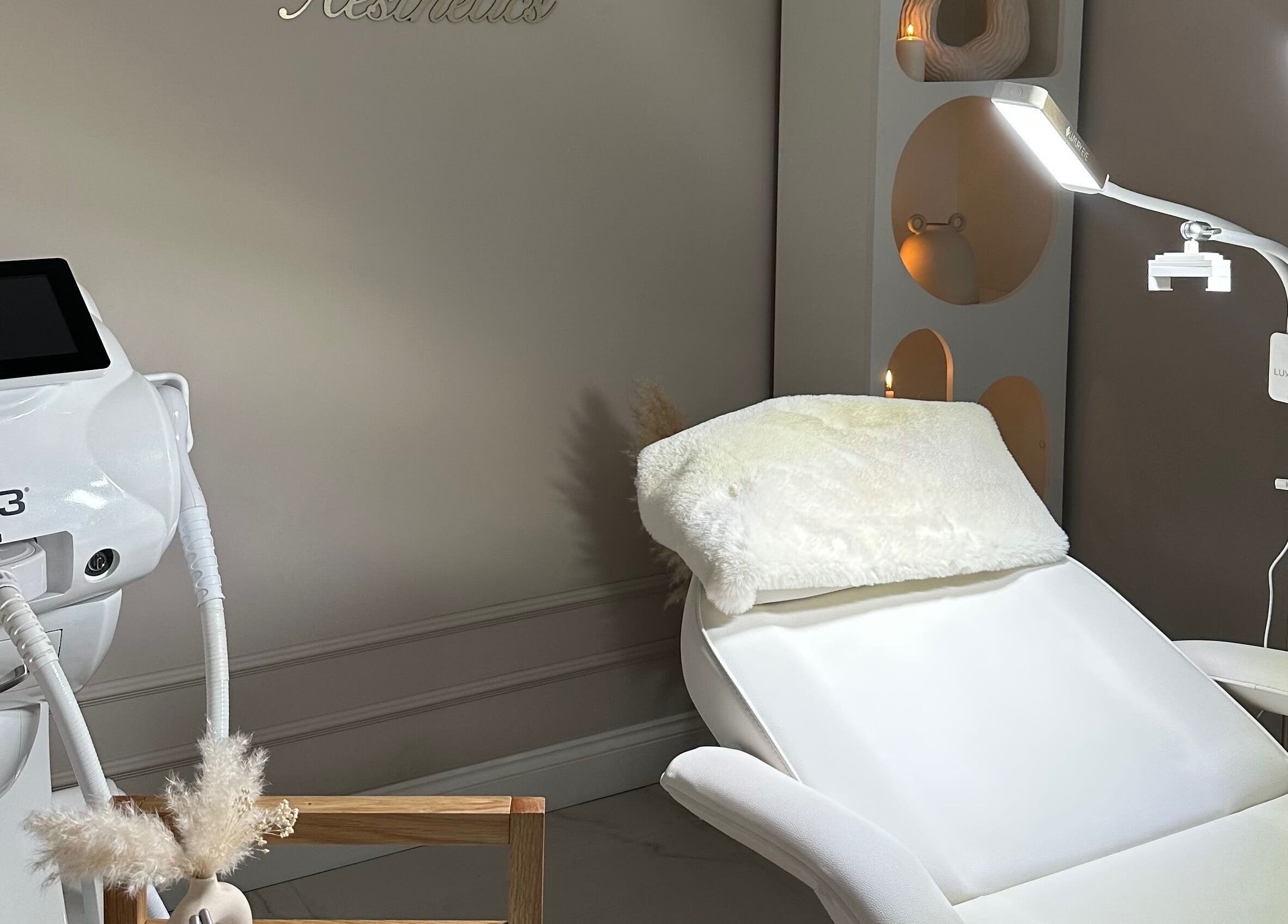 Luxurious treatment room at Selin Aesthetics, Stoke-on-Trent, England, GB showcasing a plush chair and equipment.