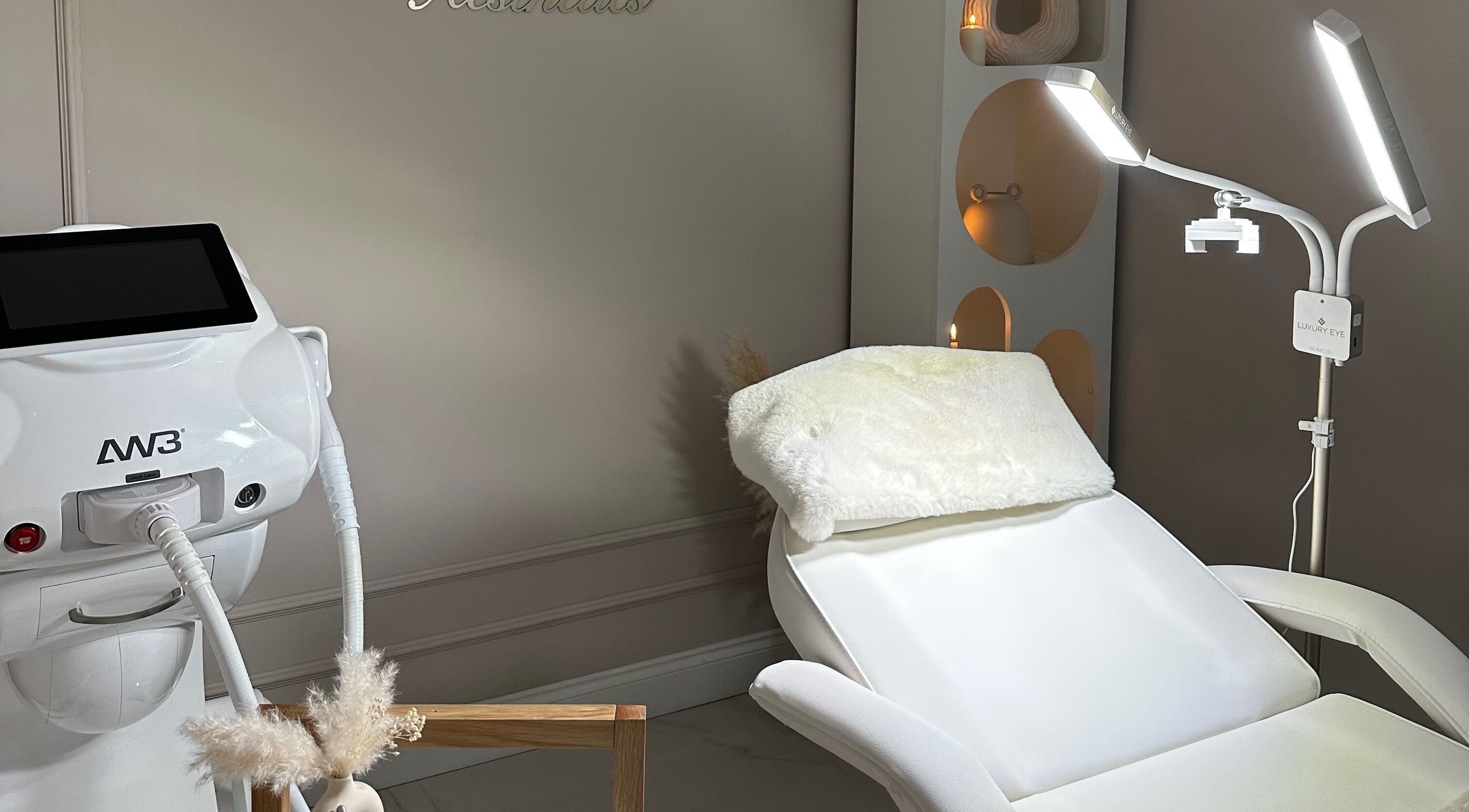 Luxurious treatment room at Selin Aesthetics, Stoke-on-Trent, England, GB showcasing a plush chair and equipment.