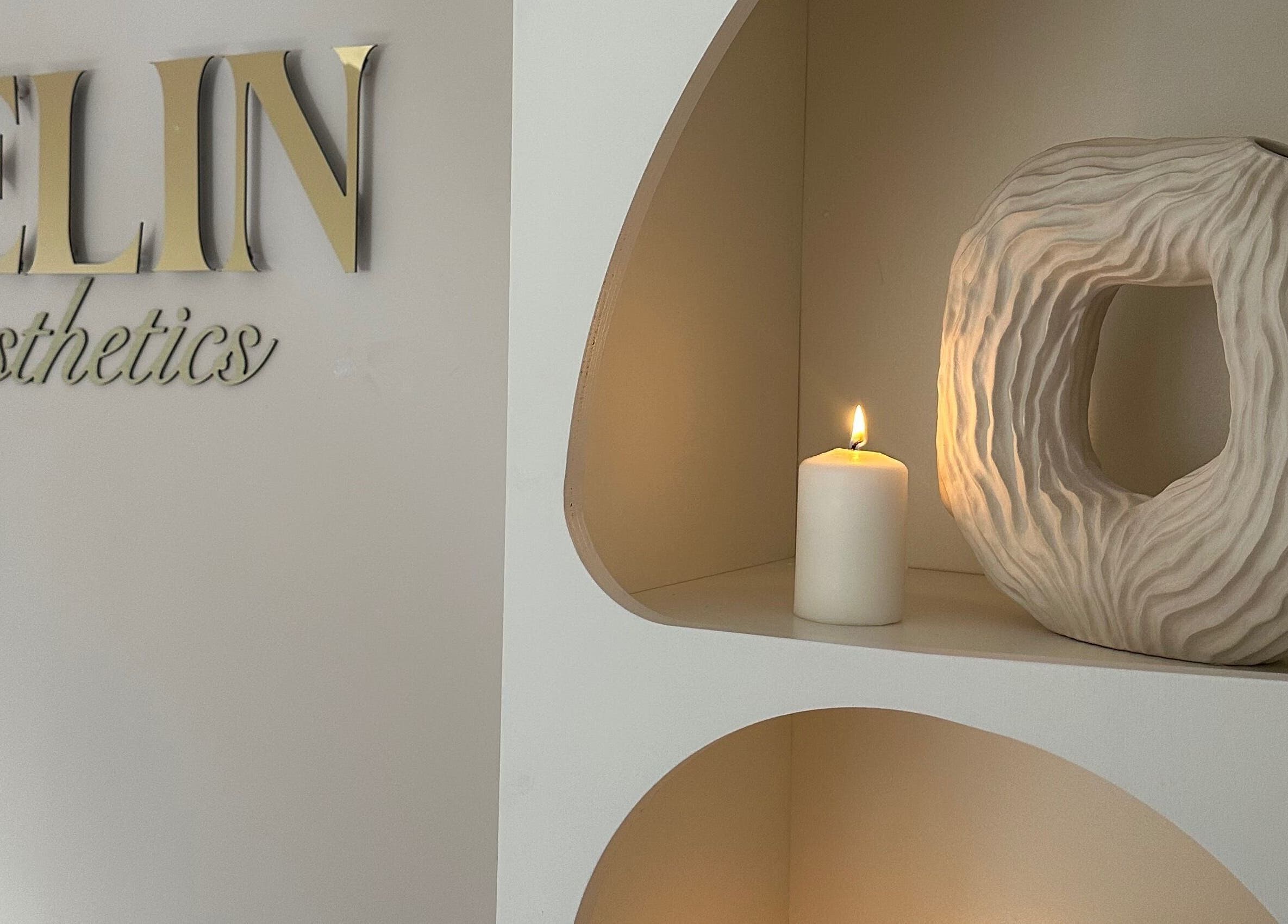Elegant decor at Selin Aesthetics, Stoke-on-Trent, England, GB featuring a candle and sculpture.