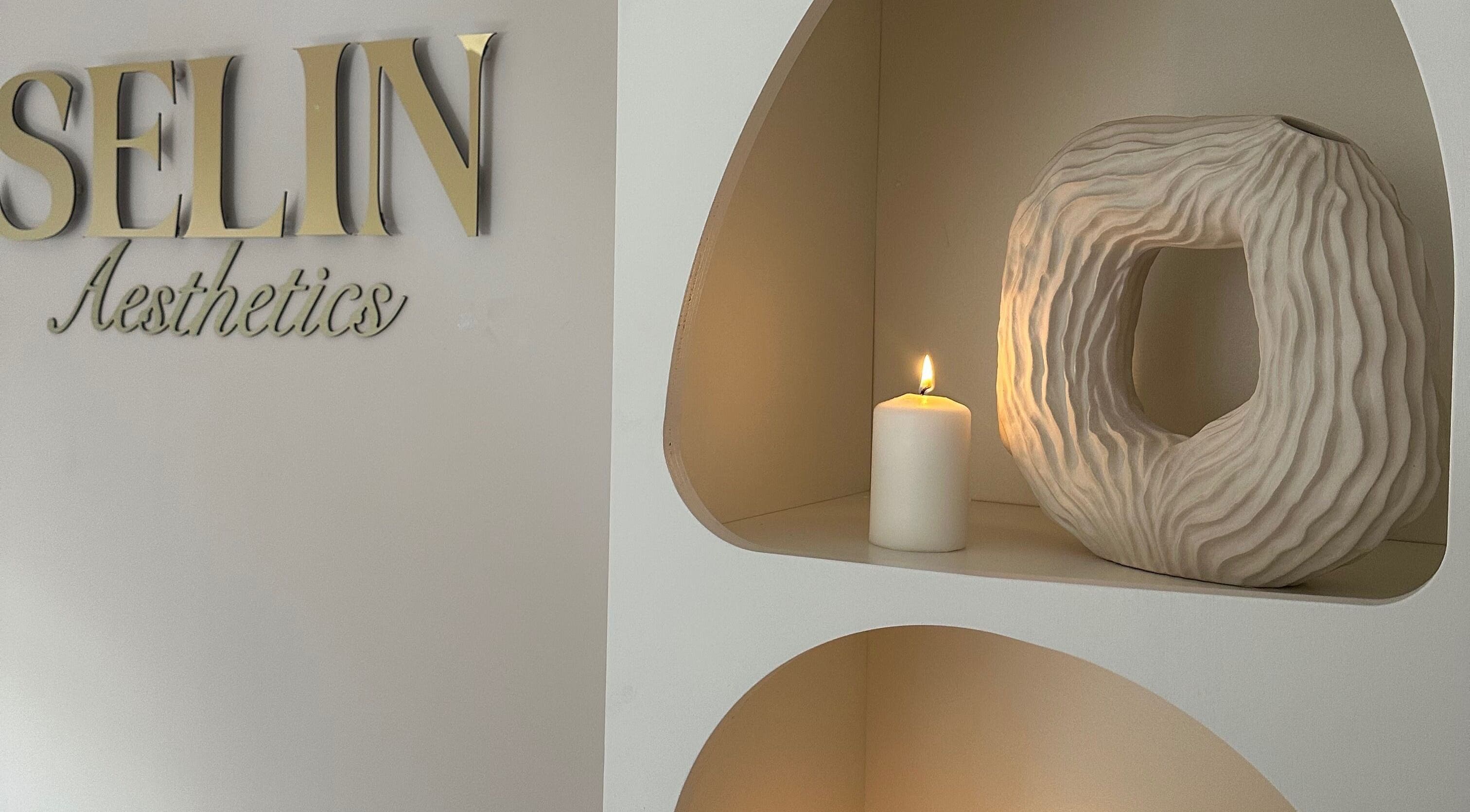 Elegant decor at Selin Aesthetics, Stoke-on-Trent, England, GB featuring a candle and sculpture.