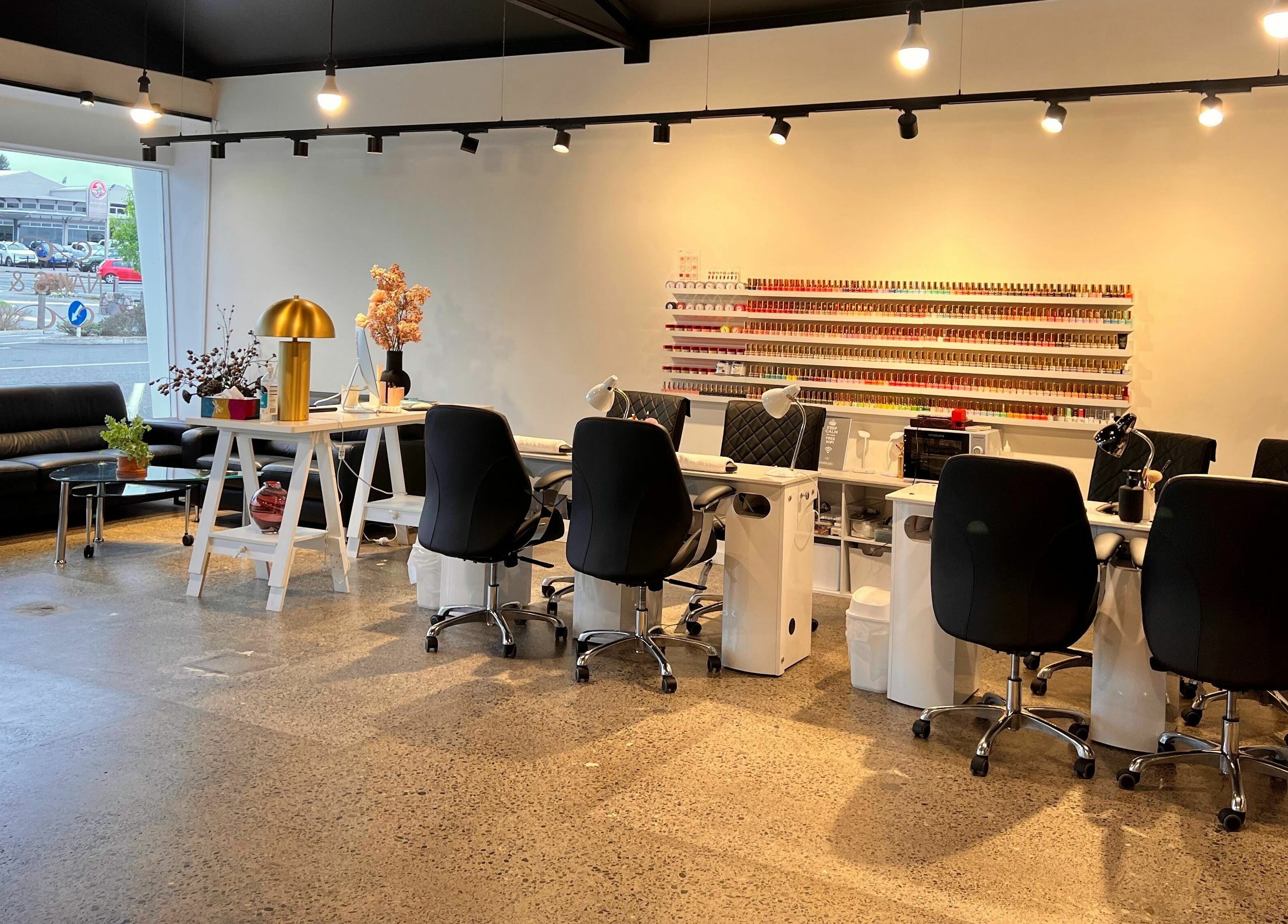 Elegant interior of The Nail Studio, Taupō, Waikato, NZ, featuring modern nail stations and vibrant decor.