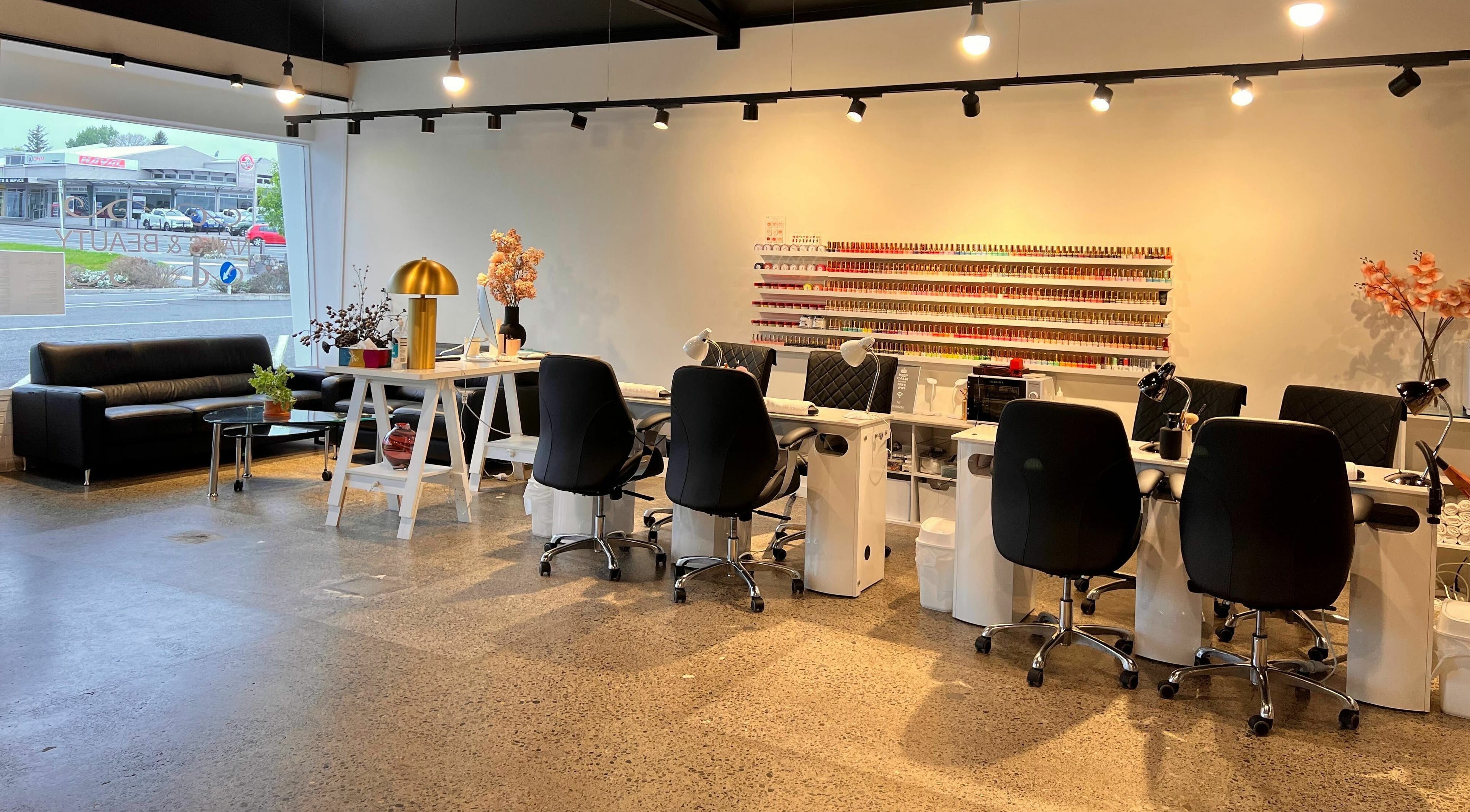 Elegant interior of The Nail Studio, Taupō, Waikato, NZ, featuring modern nail stations and vibrant decor.