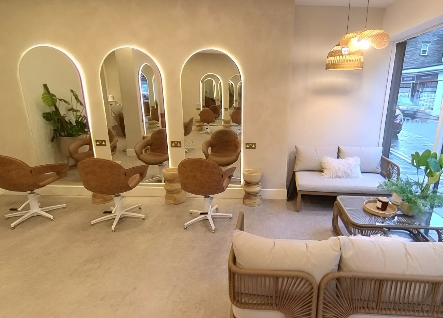 Stylish salon interior at Outback Salon, Dunfermline, Scotland, GB featuring modern chairs and cozy decor.