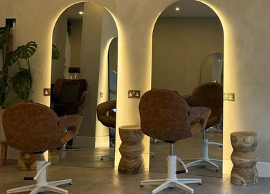 Chic salon chair and mirror setup at Outback Salon, Dunfermline, Scotland, GB with modern decor.