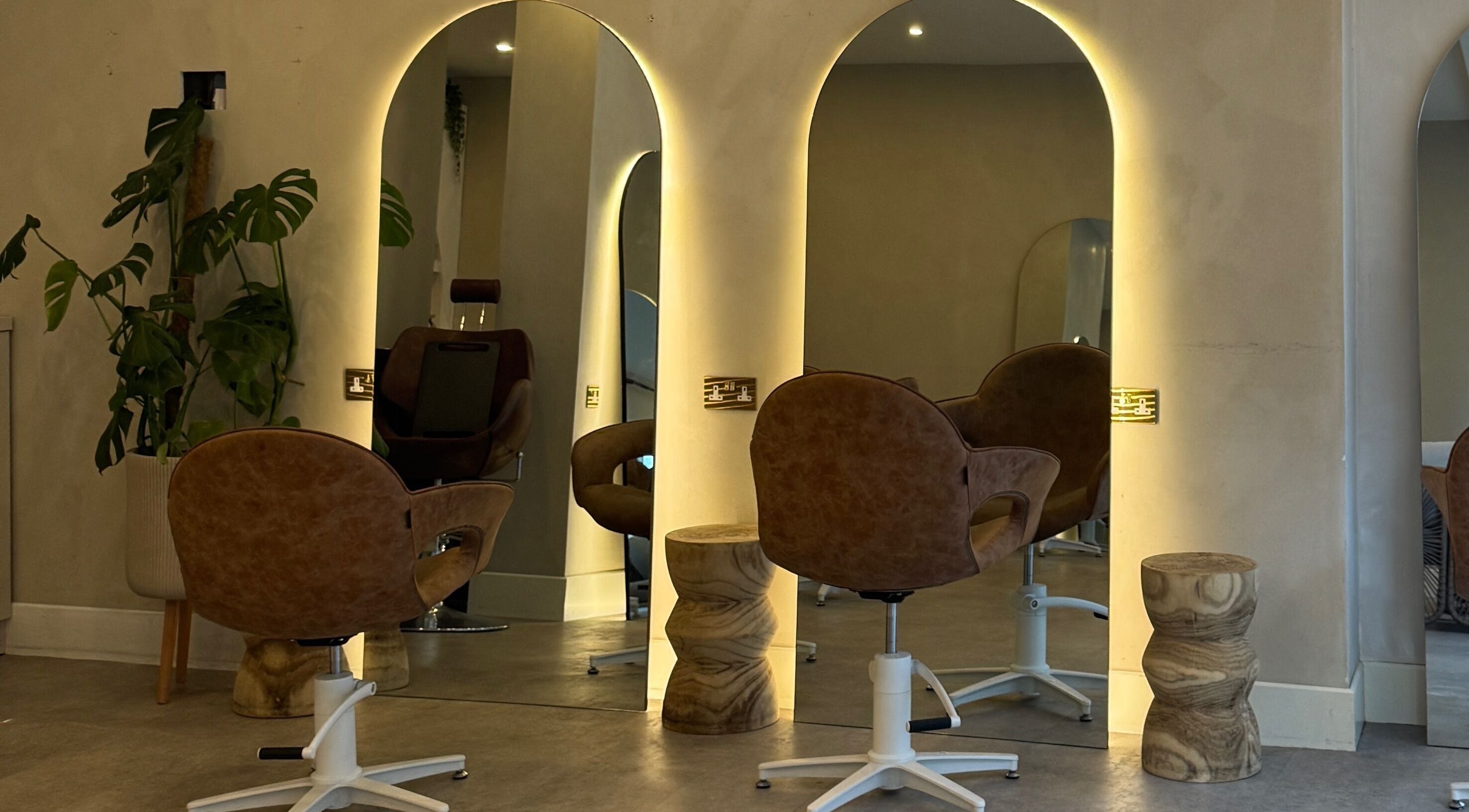 Chic salon chair and mirror setup at Outback Salon, Dunfermline, Scotland, GB with modern decor.