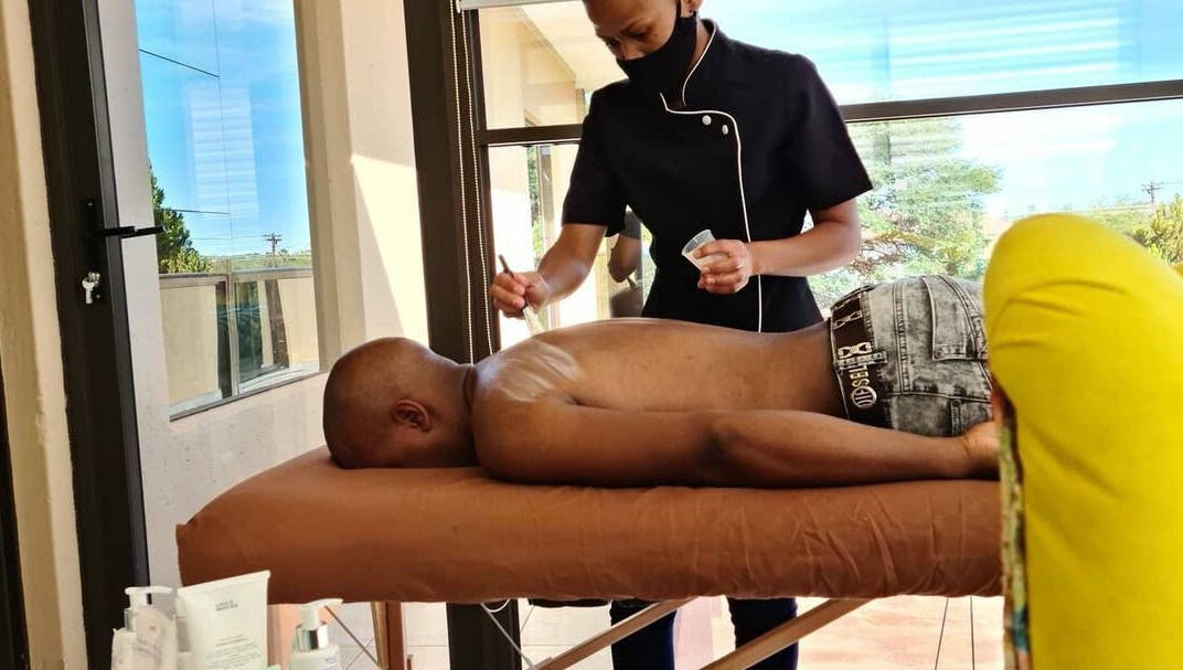 Therapist at Deepee Mobile Beauty Spa in Kuruman, Northern Cape, ZA, providing a relaxing back massage.