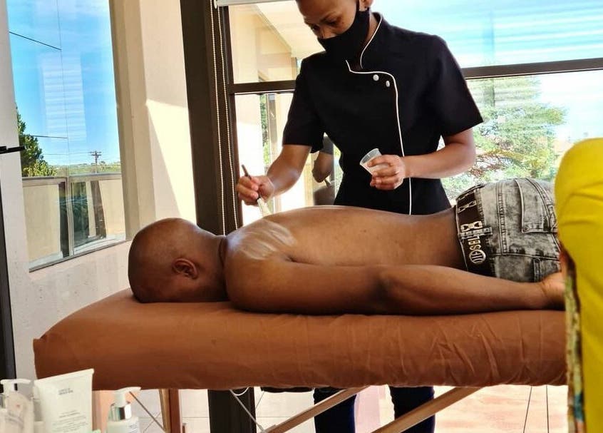 Therapist at Deepee Mobile Beauty Spa in Kuruman, Northern Cape, ZA, providing a relaxing back massage.