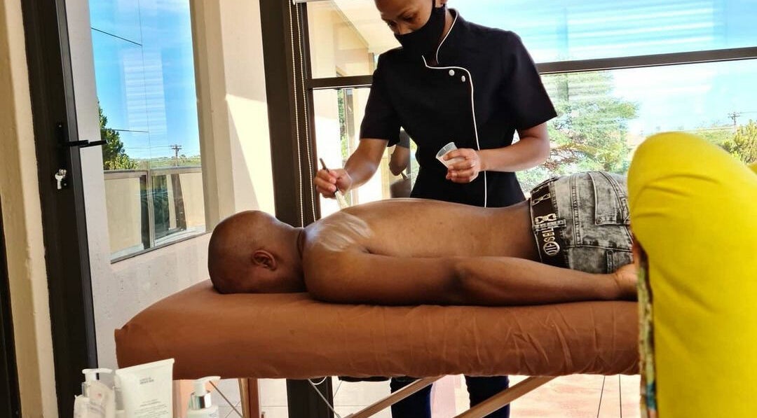 Therapist at Deepee Mobile Beauty Spa in Kuruman, Northern Cape, ZA, providing a relaxing back massage.