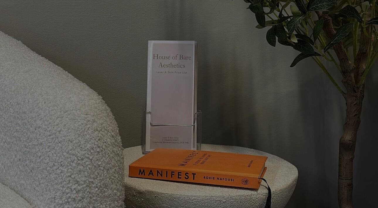 House of Bare Aesthetics brochure and book on a textured chair in Crewkerne, England, GB.