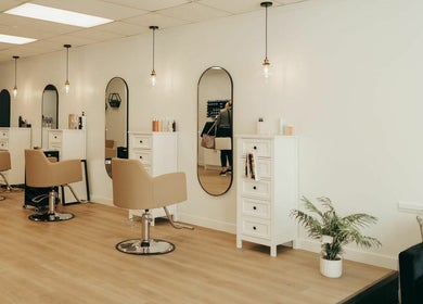 Modern salon interior at Blonde Design Co., Mount Forest, Ontario, CA showcasing sleek design and comfort.