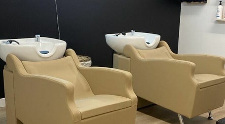 Comfortable salon chairs and washing stations at Blonde Design Co., Mount Forest, Ontario, CA.