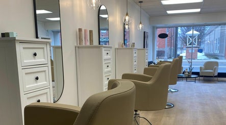 Chic salon interior at Blonde Design Co., Mount Forest, Ontario, CA with modern chairs and elegant decor.