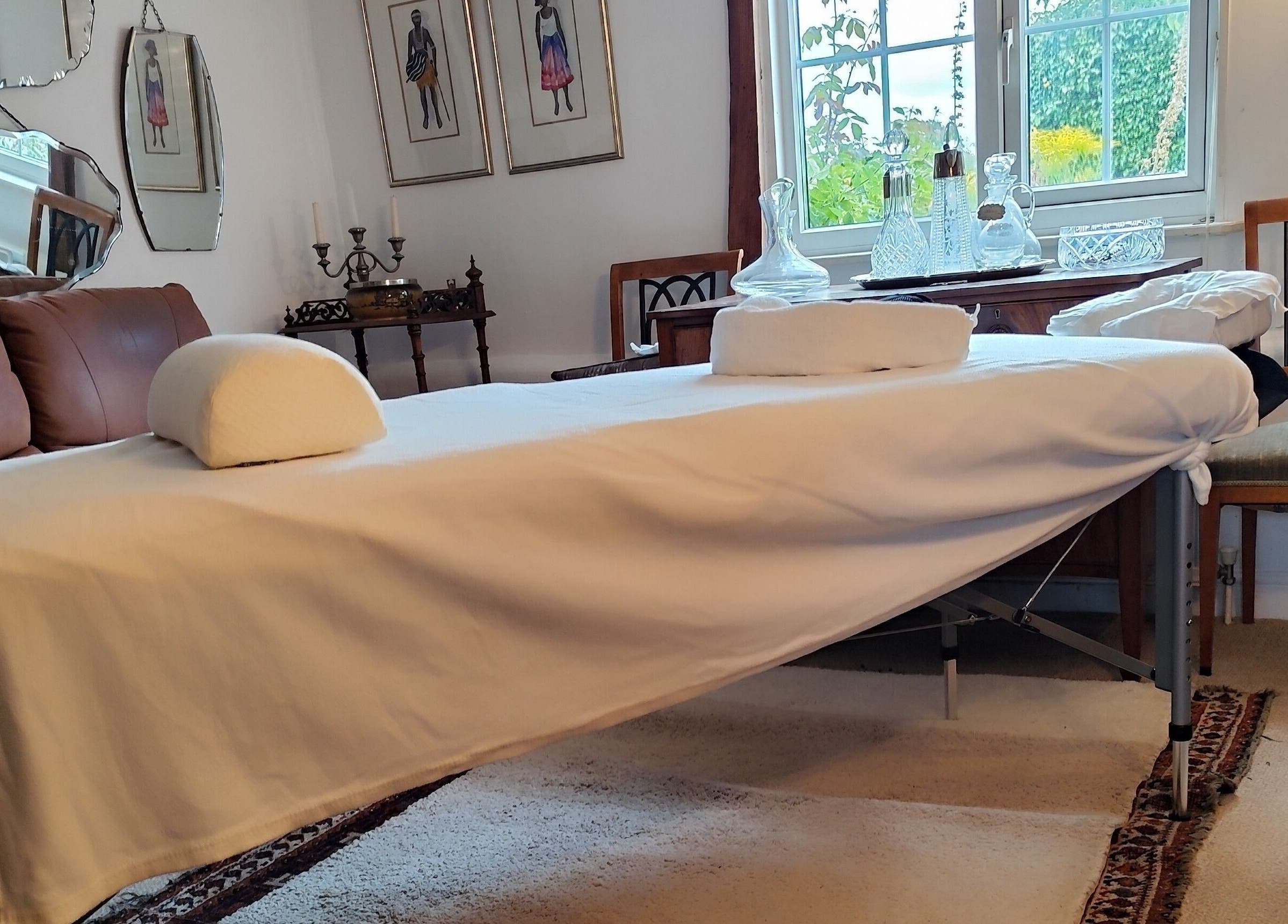 Relaxing massage table setup at MP's Mobile Massages, Ipswich, GB, surrounded by elegant decor.