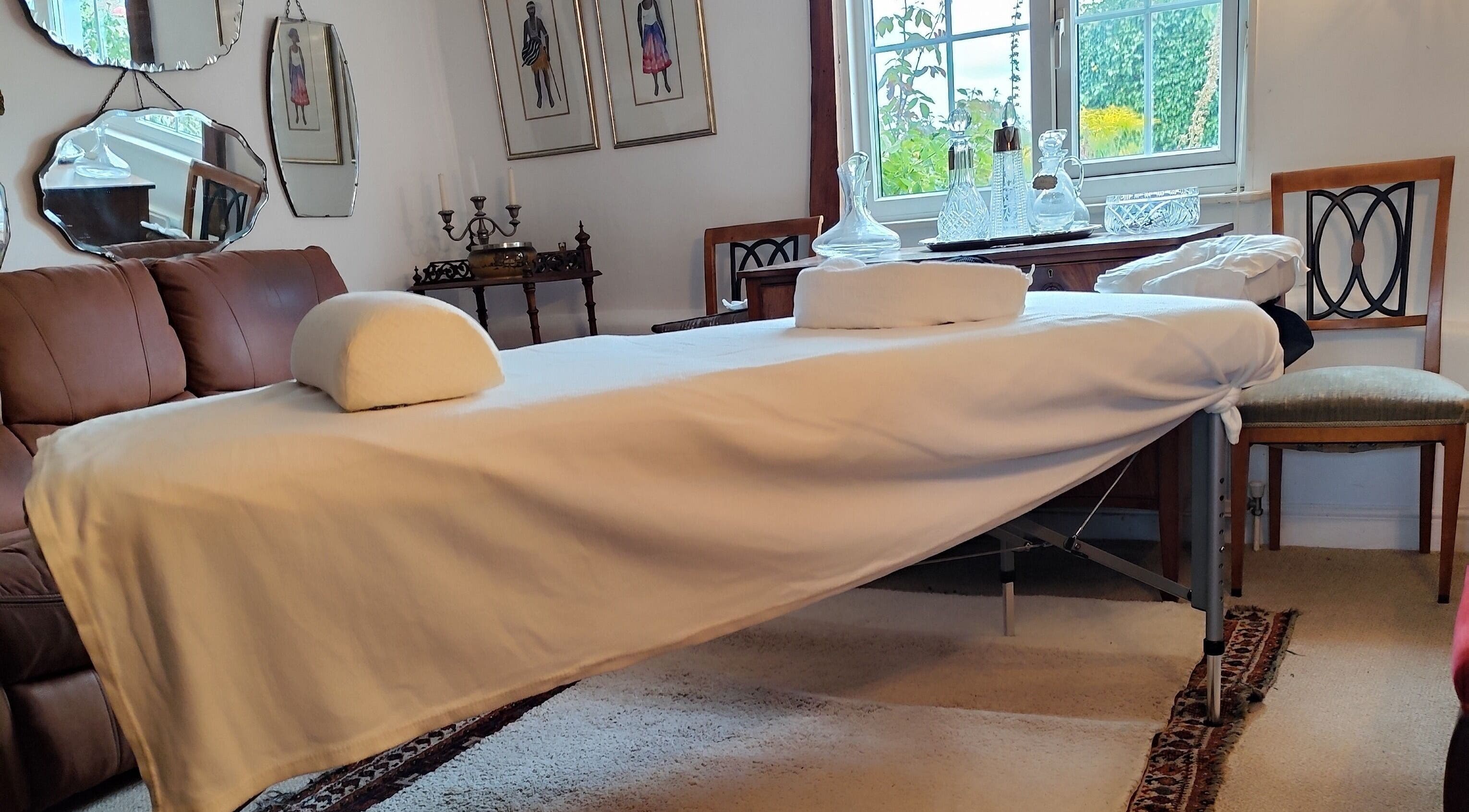 Relaxing massage table setup at MP's Mobile Massages, Ipswich, GB, surrounded by elegant decor.