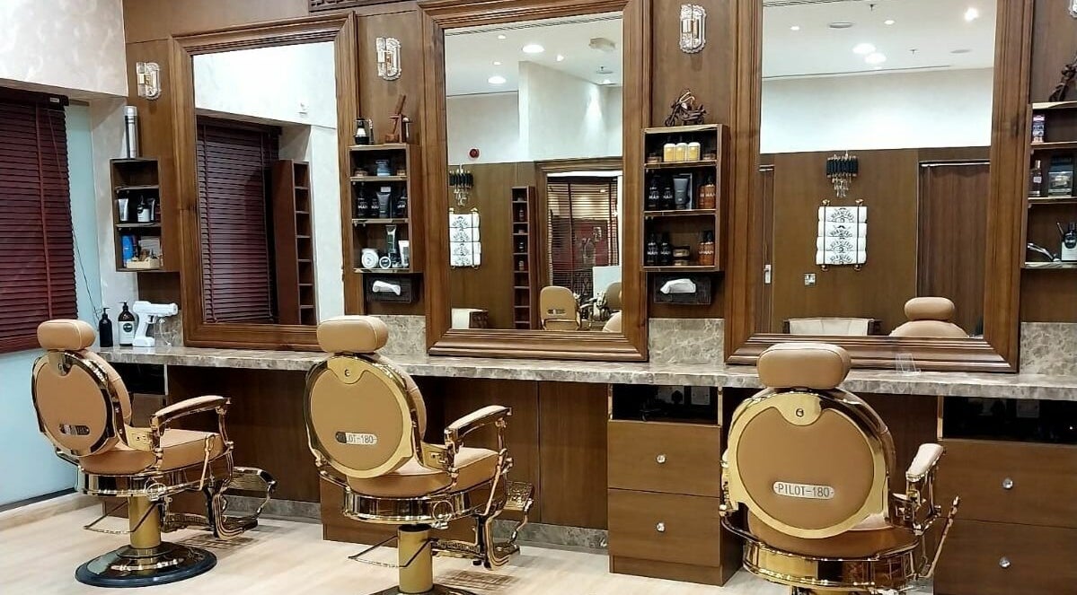 Luxurious interior of Care of Hair Gents Salon in Dubai, Dubai, AE featuring stylish barber chairs.