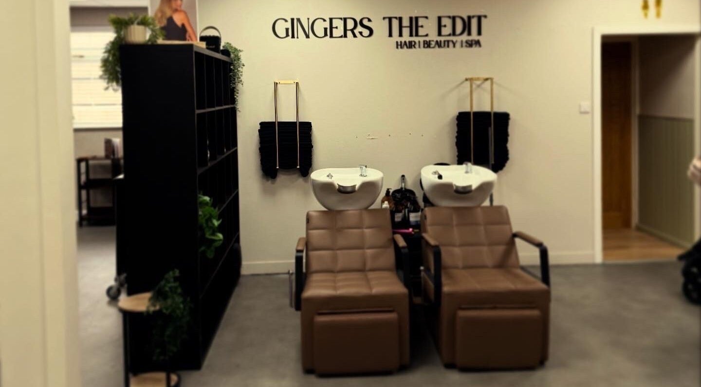 Elegant wash stations at Hair by Holly Haxton in Swindon, England, GB. Comfortable seating and modern decor.