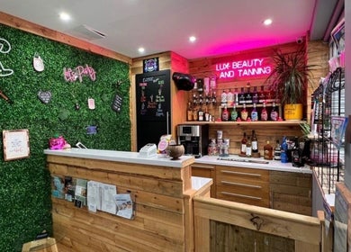 Modern interior of Nails by Liz with vibrant bar setup in Leabrooks, England, GB.