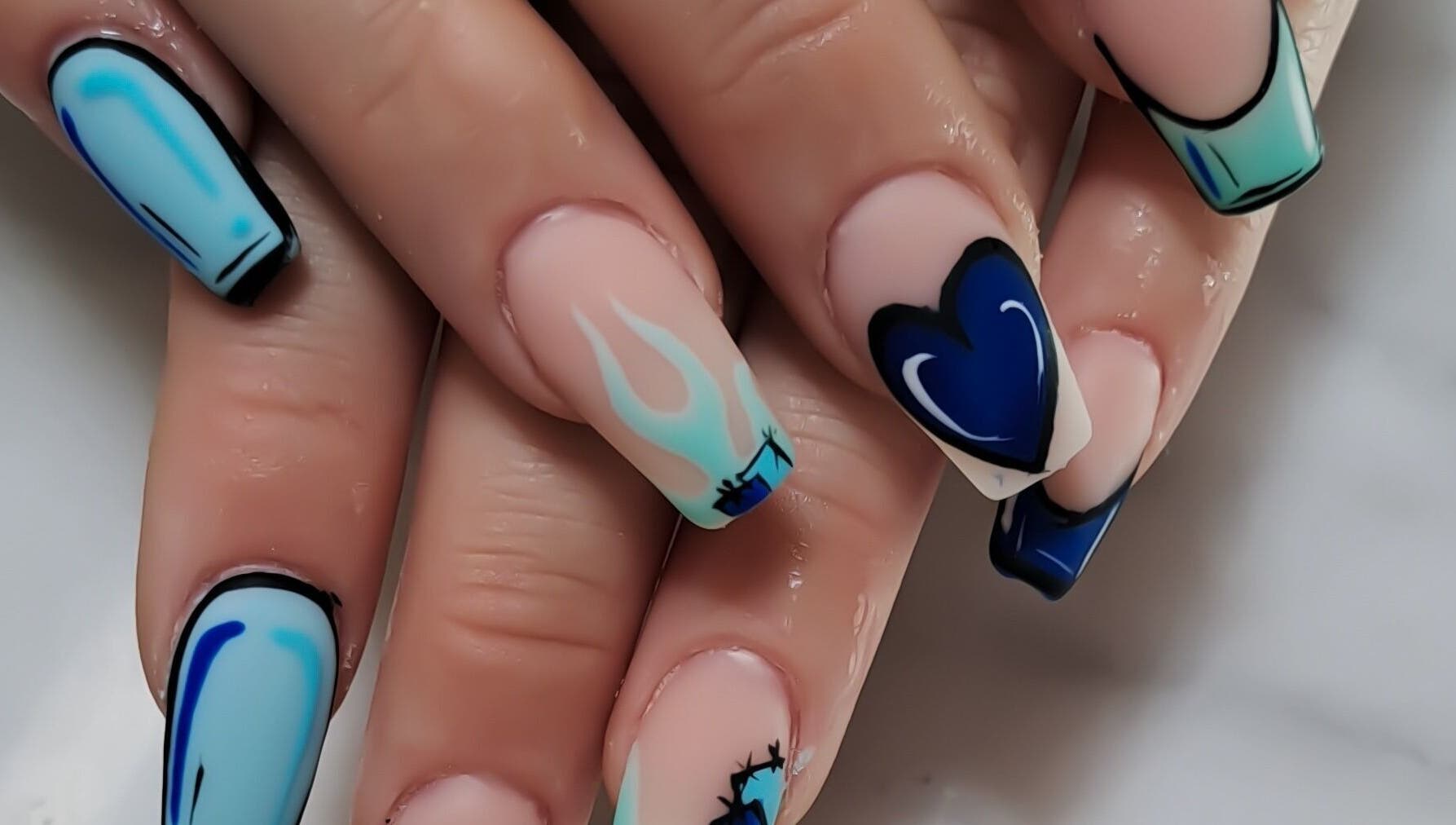 Blue and white artistic nails at Minx nails & beauty, Cape Town, Western Cape, ZA, showcasing unique patterns.