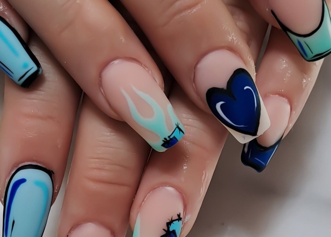 Blue and white artistic nails at Minx nails & beauty, Cape Town, Western Cape, ZA, showcasing unique patterns.