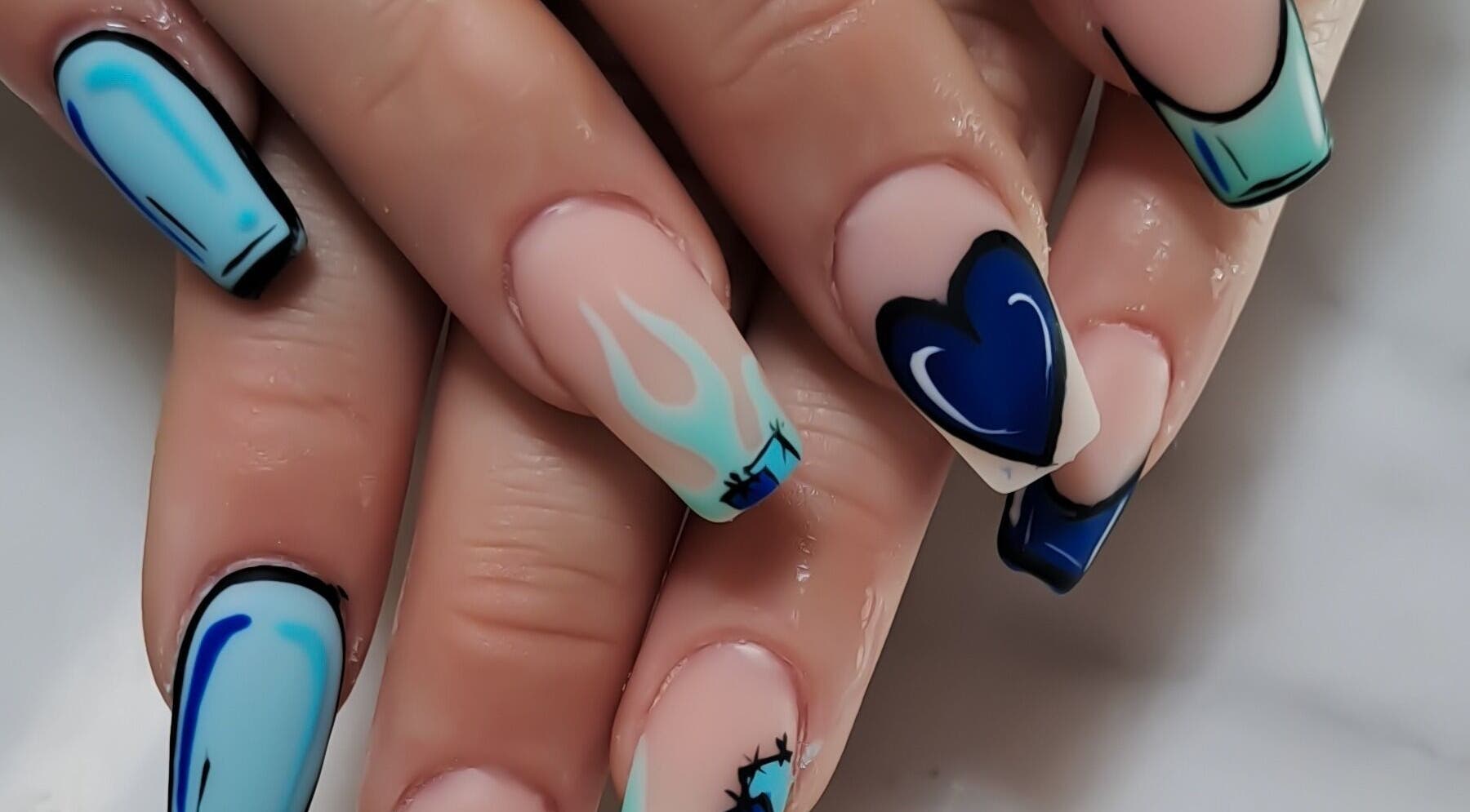 Blue and white artistic nails at Minx nails & beauty, Cape Town, Western Cape, ZA, showcasing unique patterns.