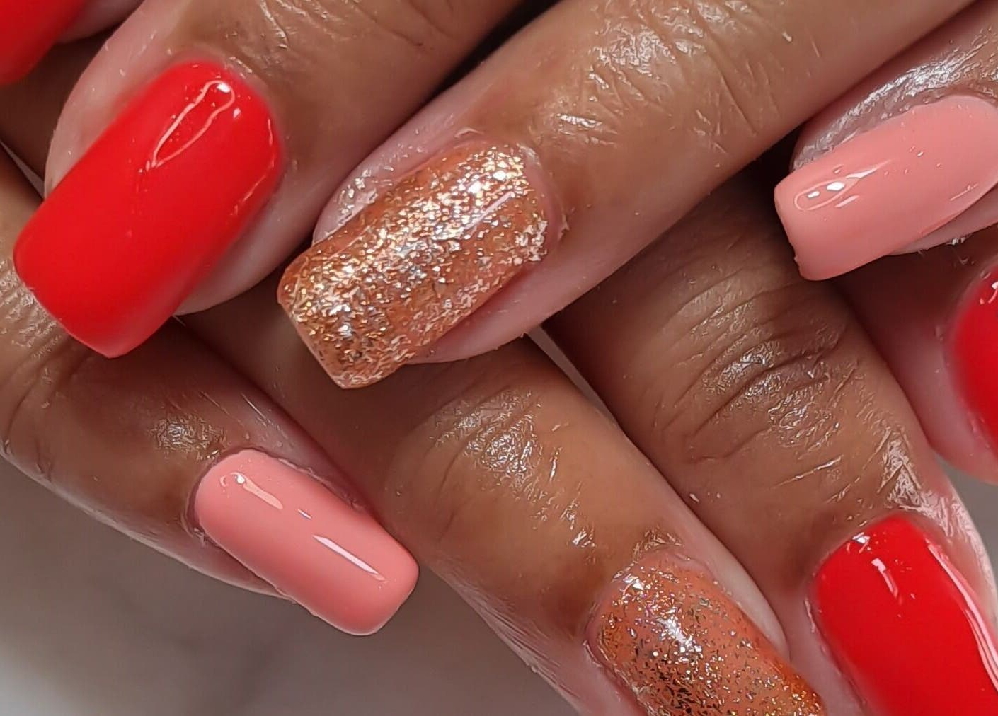 Elegant red and gold glitter nails at Minx nails & beauty, Cape Town, Western Cape, ZA.