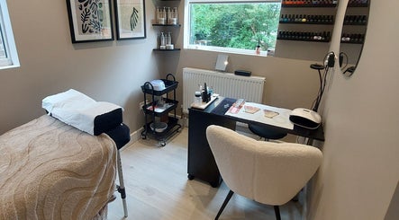 Tranquil treatment room at Beauty by Kirsty, Waterlooville, England, featuring cozy decor and nail polish display.
