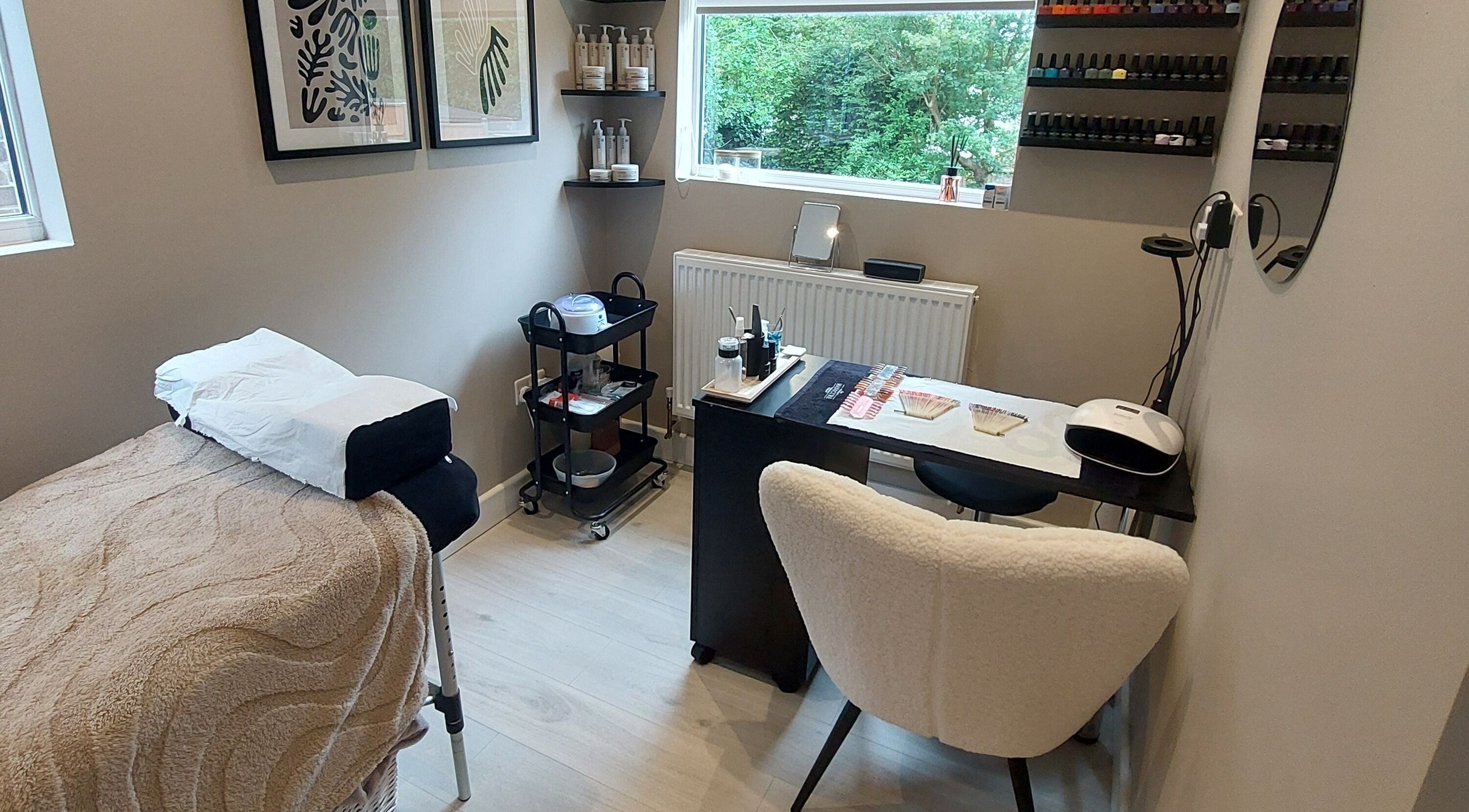 Tranquil treatment room at Beauty by Kirsty, Waterlooville, England, featuring cozy decor and nail polish display.