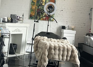 A plush treatment room at Cosmeticca Skin Clinic, Melbourne, Victoria, AU, featuring a luxurious fur blanket.
