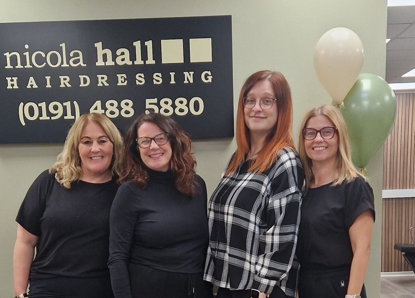 Team at Jenna's Holistic Beauty Room, Whickham, England, GB, smiling indoors with balloons and a sign.