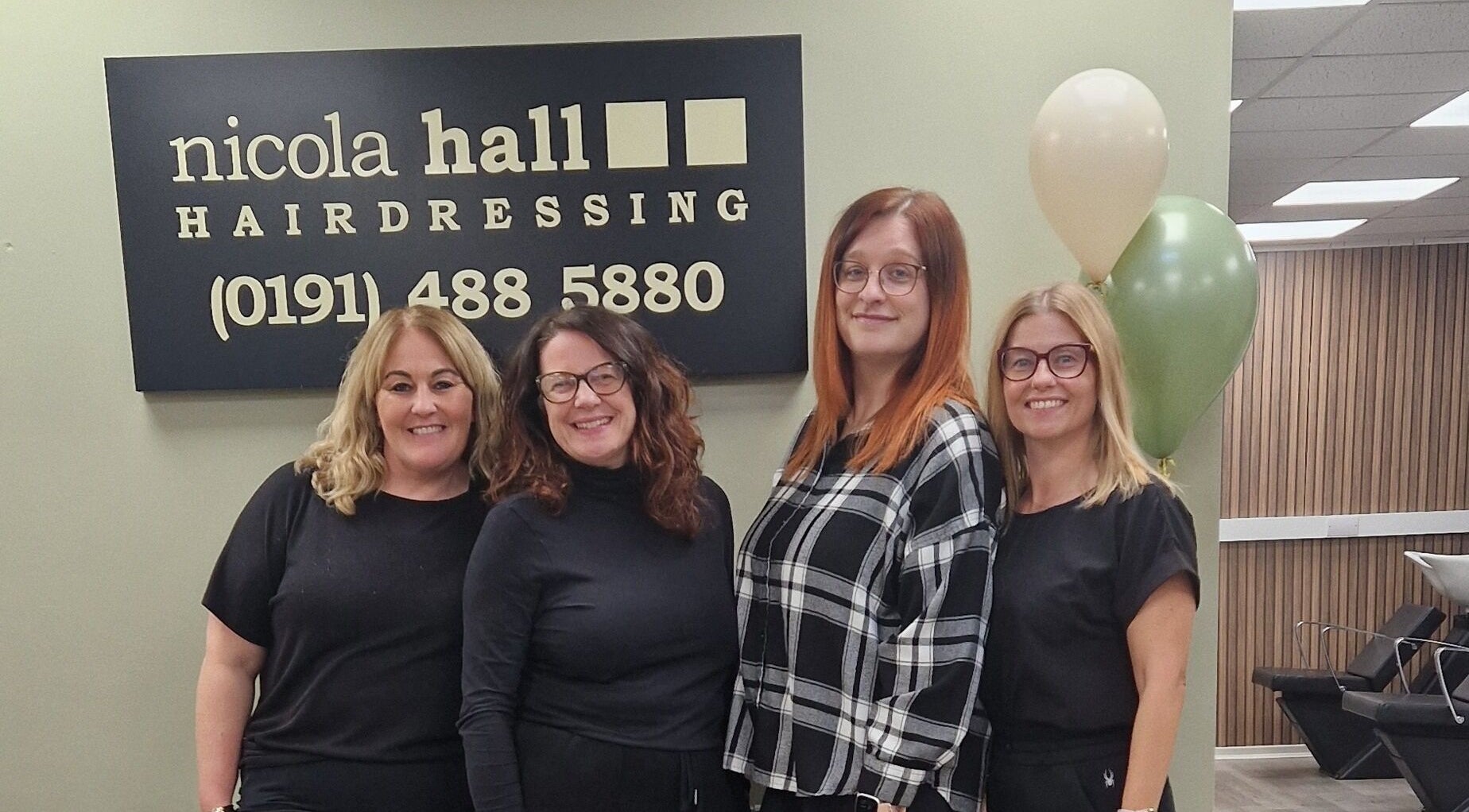 Team at Jenna's Holistic Beauty Room, Whickham, England, GB, smiling indoors with balloons and a sign.