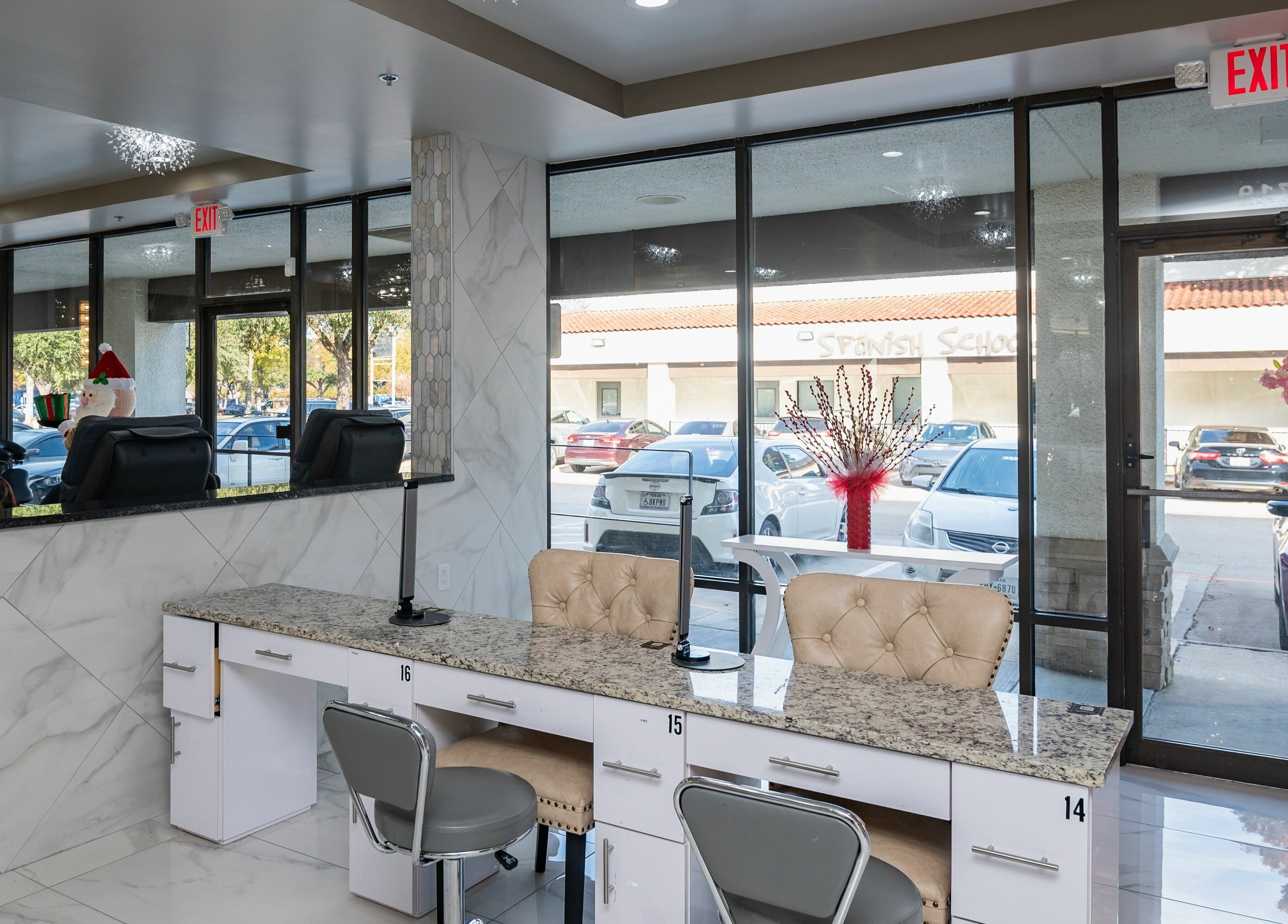 Interior of French Nails Luxury Spa and Bar in Dallas, Texas, US with modern decor and plush seating.