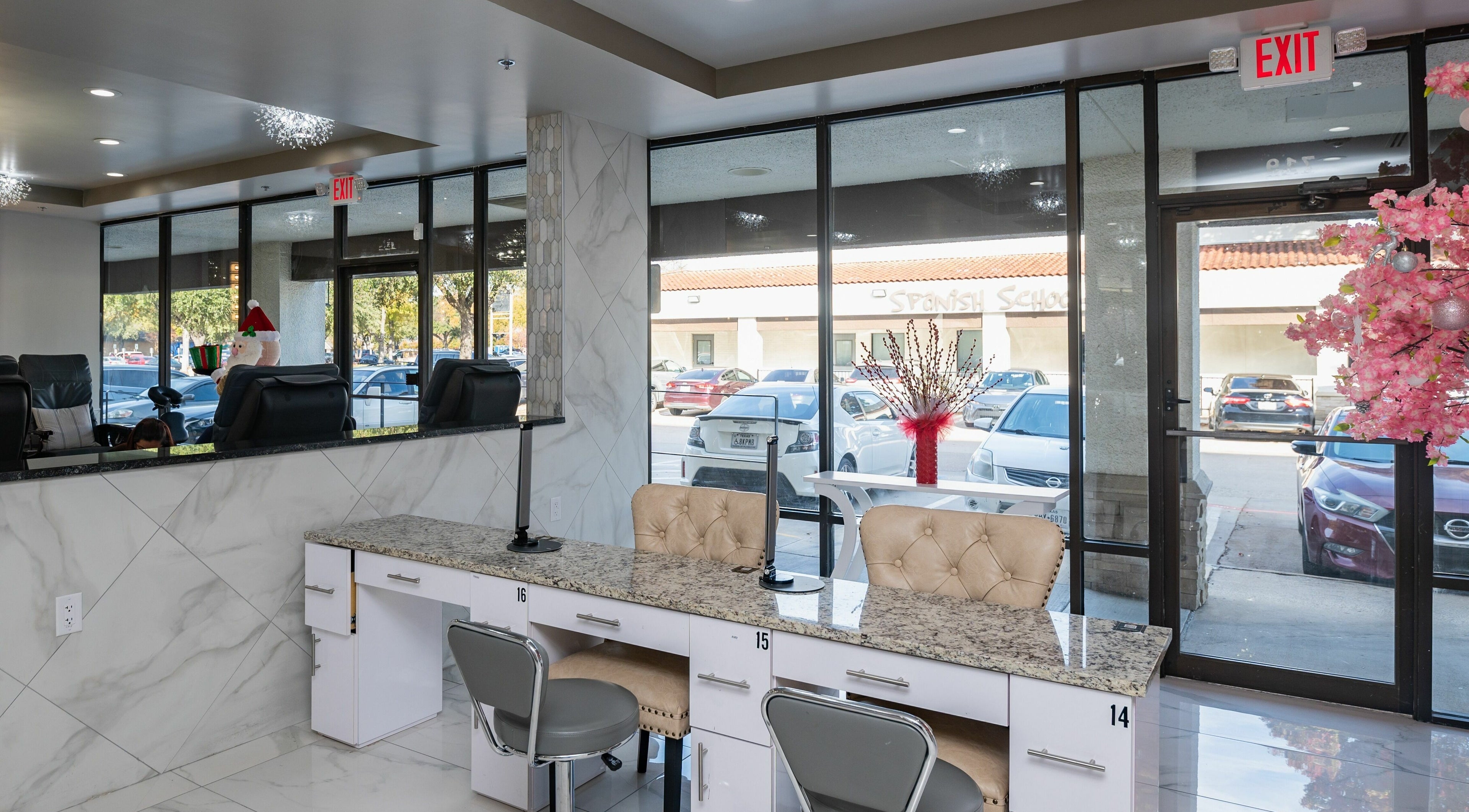 Interior of French Nails Luxury Spa and Bar in Dallas, Texas, US with modern decor and plush seating.