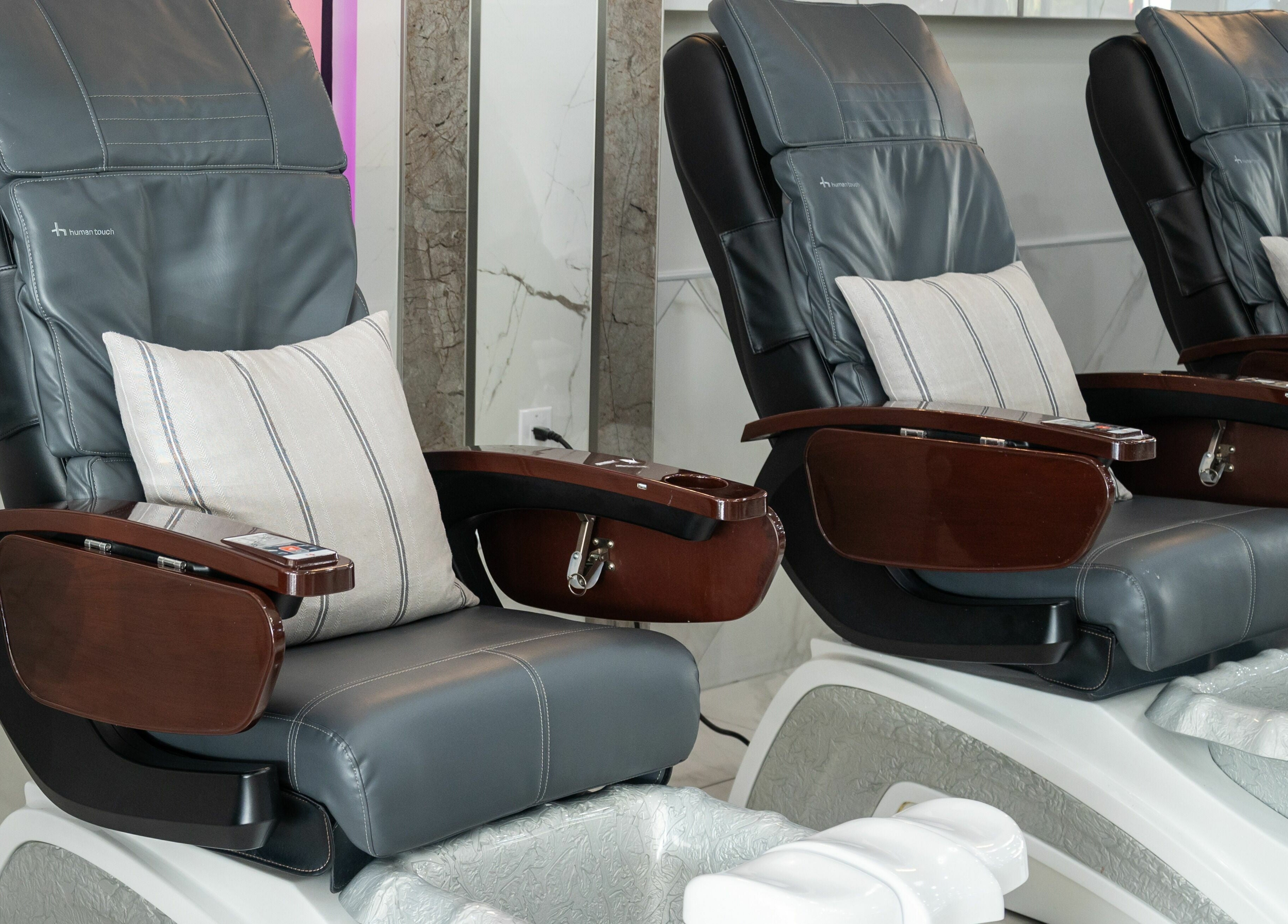 Elegant pedicure chairs at French Nails Luxury Spa and Bar in Dallas, Texas, US offer comfort and style.