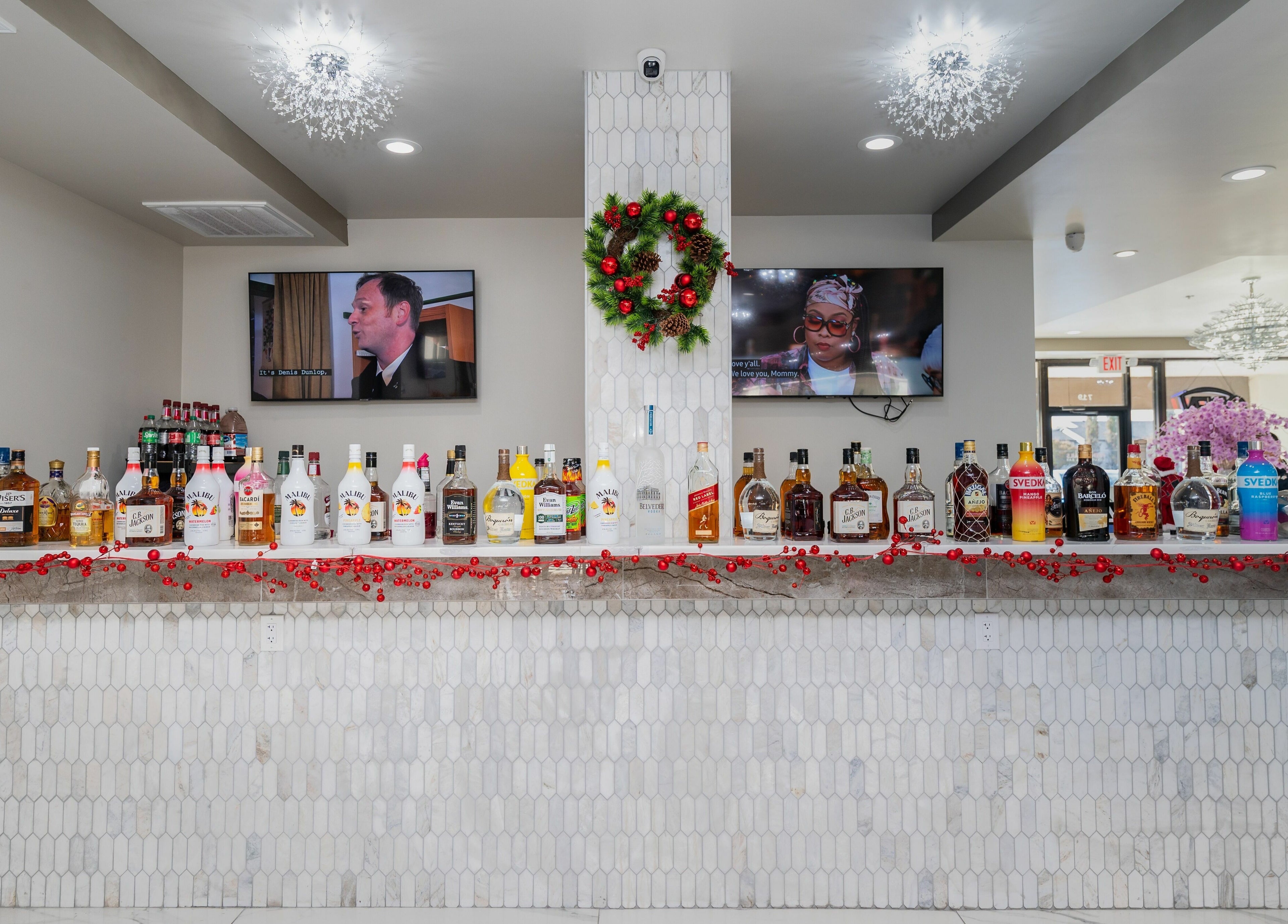 Elegant bar at French Nails Luxury Spa and Bar in Dallas, Texas, US, adorned with festive drinks display.