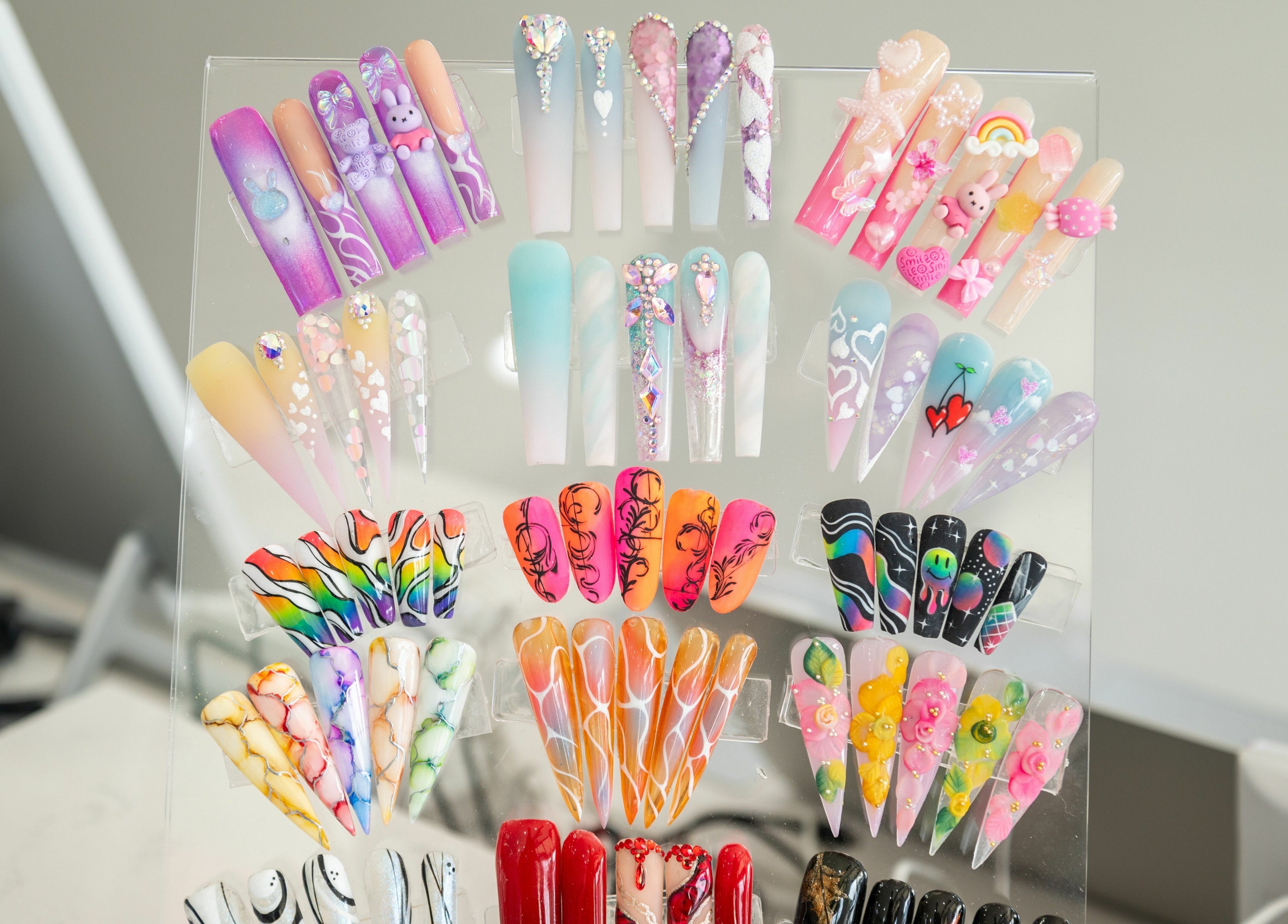 Vibrant nail art display at French Nails Luxury Spa and Bar, Dallas, Texas, US showcases unique designs.
