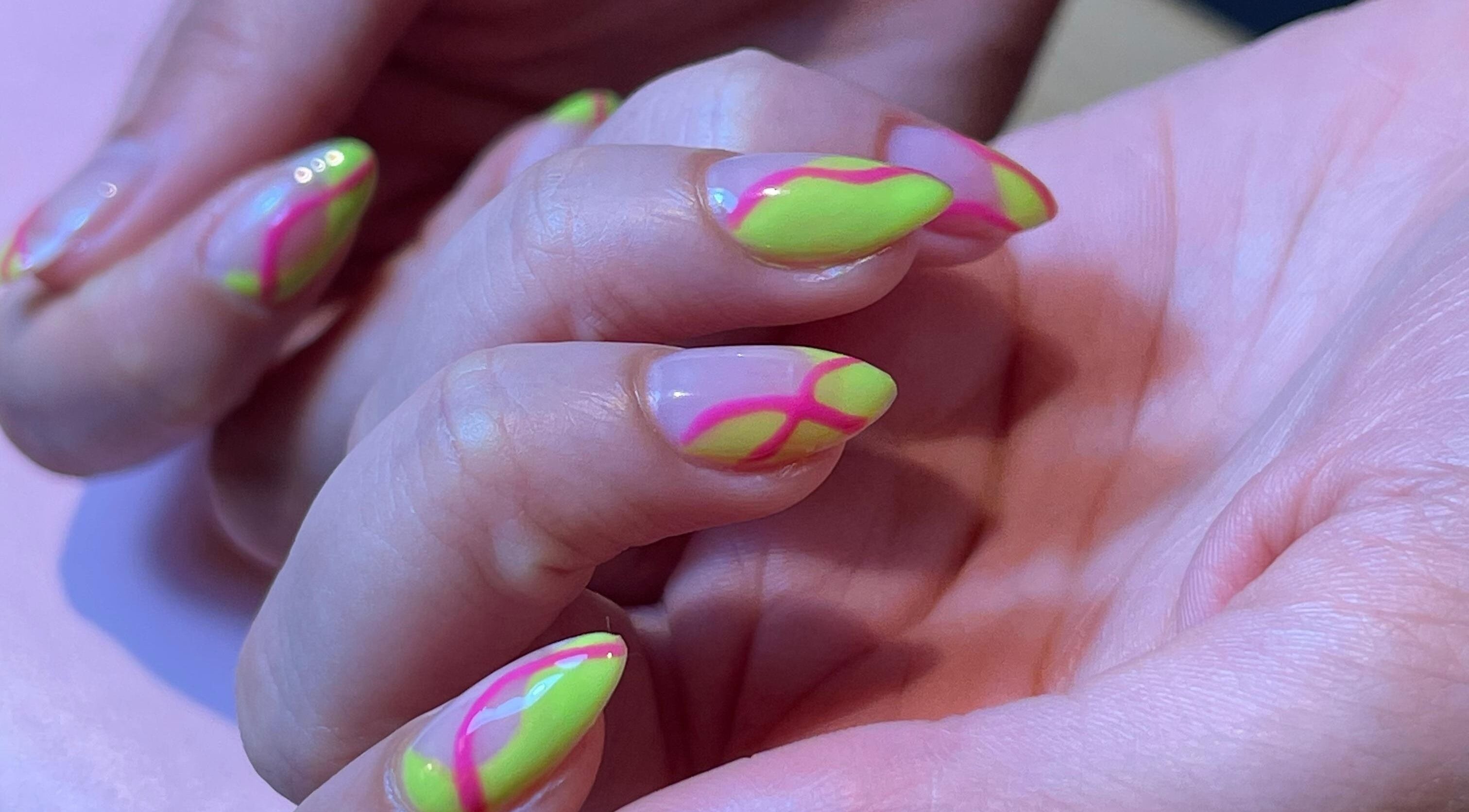 Vibrant neon nail art by Lashed Home Service | الخدمات المنزلية in Jeddah, Makkah Province, SA.
