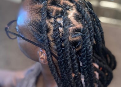 Close-up of detailed braids at Ttee Da Goat Stylez, North Charleston, South Carolina, US, showcasing expert styling.